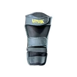 Espinilleras kick boxing Utuk infantiles (negro/oro) 1